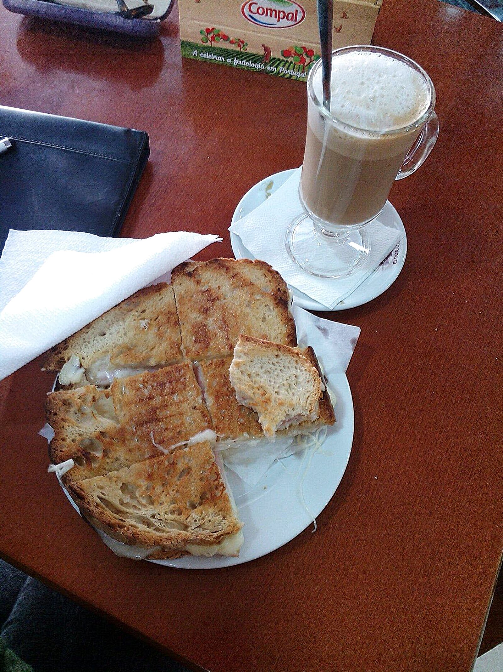 Toast on a table at Pastelaria Al-Karib, with coffee