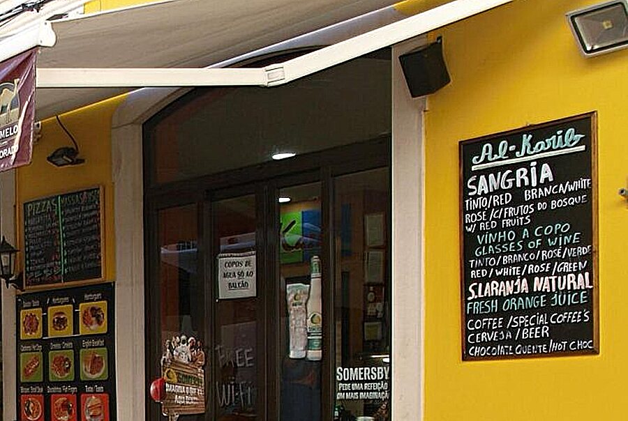 The Al-Karib shopfront, with the drinks board
